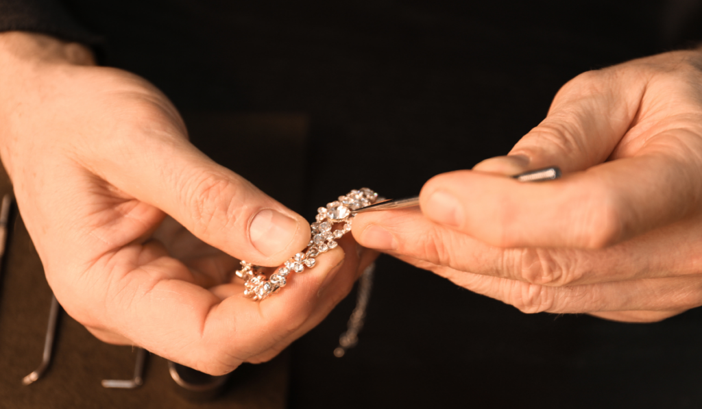 boyersjewelers_featuredimage Stock Image of Jeweler Hands inspecting a diamond bracelet