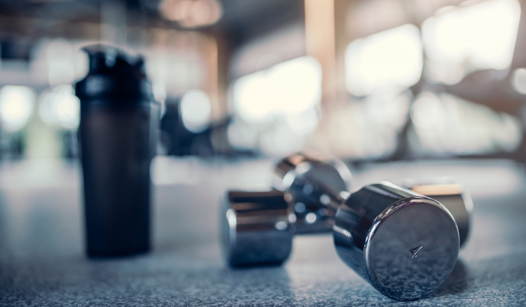 stock image of a water bottle and weights