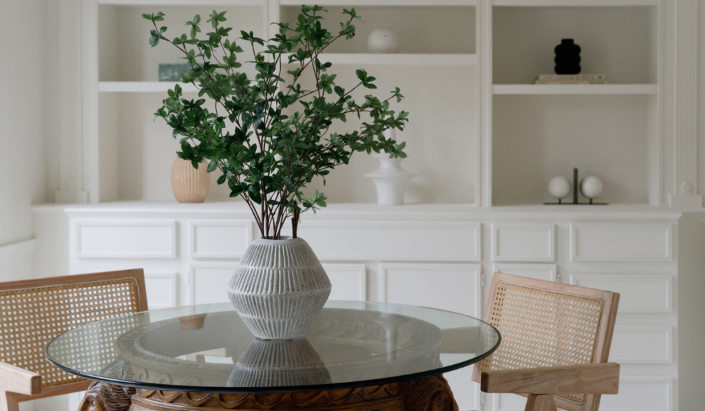 Stock image of a table with a vase and greenery
