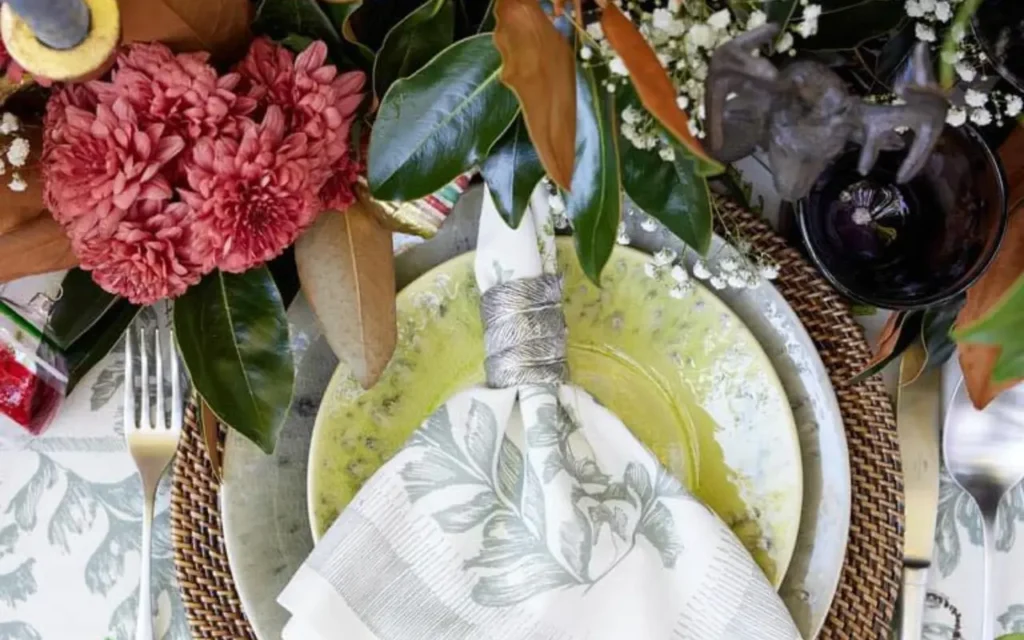 welcomehome_table Napkin with ring sitting on a dinner plate styled by Welcome Home Markets